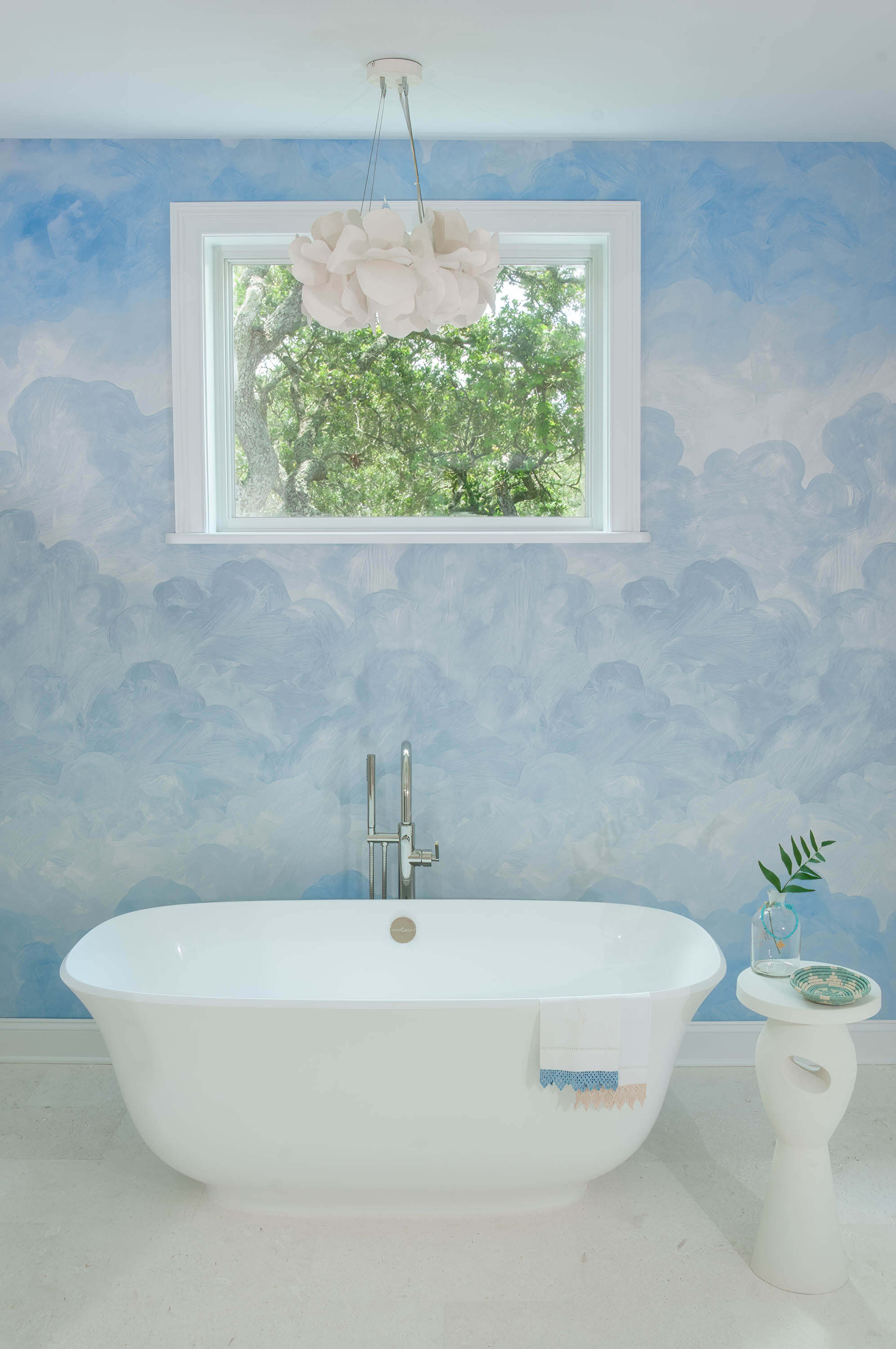 Stand-alone tub with cloud wallpaper