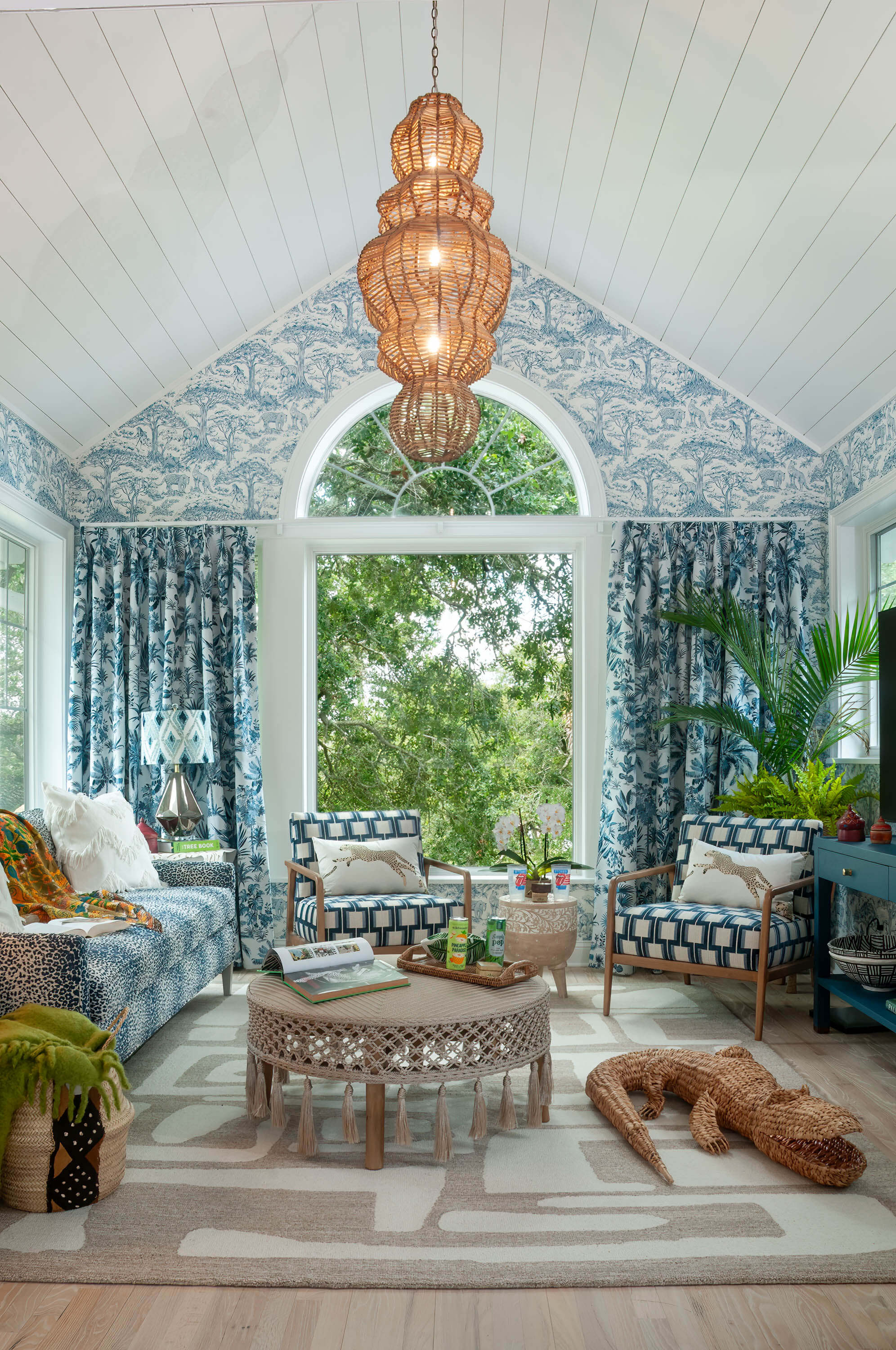 TV Room with large windows and chandelier